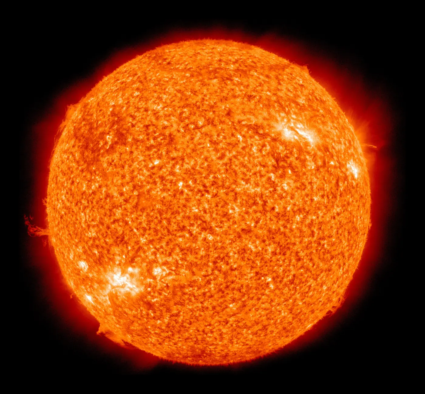 The Sun in extreme ultraviolet, glowing orange with bright active regions